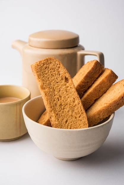 Indian punjabi or Delhi bread or tutti fruitti flavoured toast, served with indian hot tea, selective focus texture