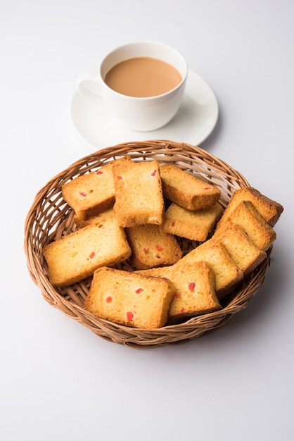 Indian punjabi or Delhi bread or tutti fruitti flavoured toast, served with indian hot tea, selective focus texture