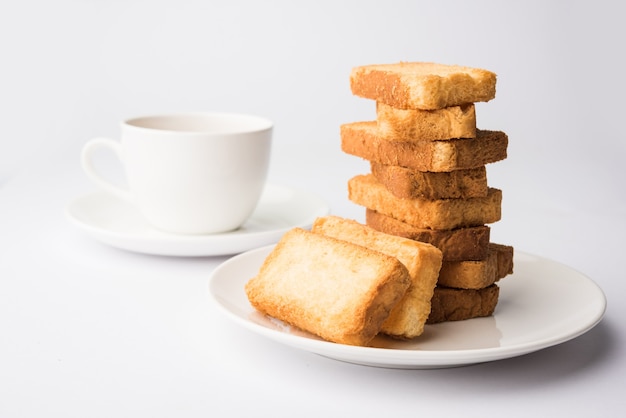 Indian punjabi or Delhi bread or tutti fruitti flavoured toast, served with indian hot tea, selective focus texture