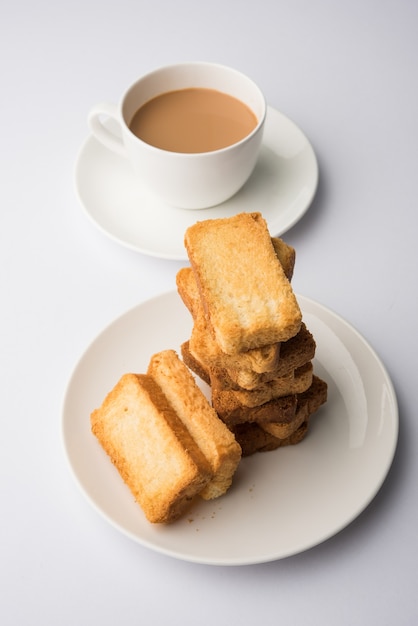 Indian punjabi or Delhi bread or tutti fruitti flavoured toast, served with indian hot tea, selective focus texture