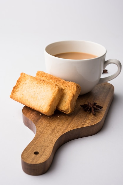 Indian punjabi or Delhi bread or tutti fruitti flavoured toast, served with indian hot tea, selective focus texture