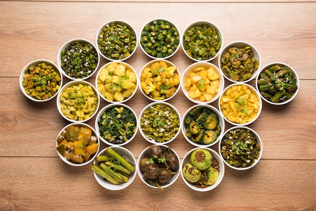 Indian sabzi, vegetable fried recipes served in white bowl over moody or colourful surface. selective focus