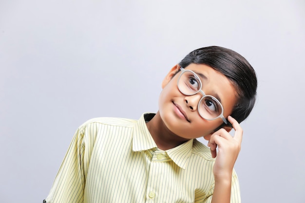 Indian school boy giving thinking gesture