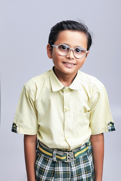 Indian school boy in uniform and giving expression