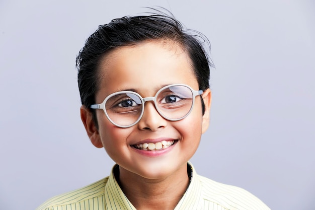 Indian school boy in uniform and giving expression