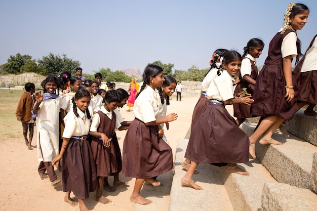 Indian school girls wearing brown and white uniform