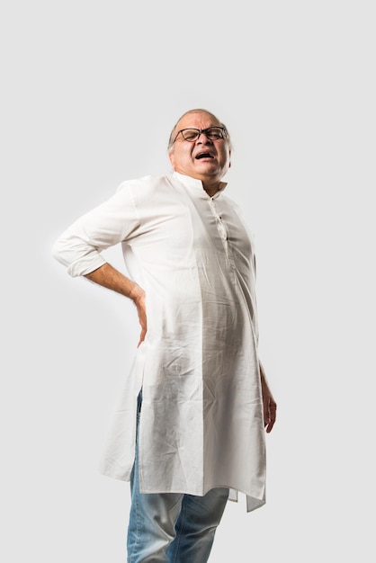 Indian senior or old man having ache or body pain sad expressions