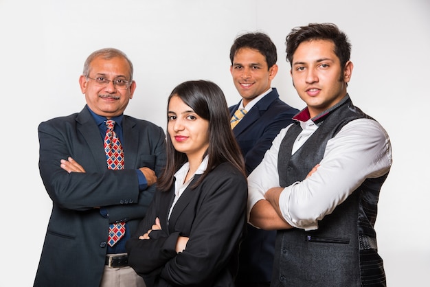 Indian smart Business people OR lawyer in suit standing as a team, isolated over white background, looking at camera