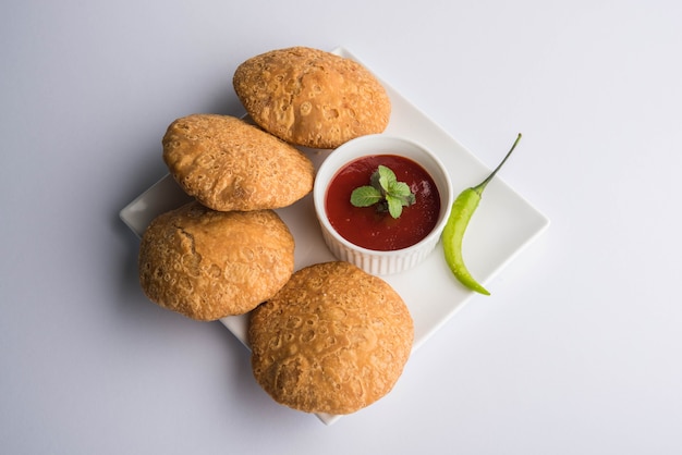 Indian special traditional matar or green peas Kachori served with tomato sauce and hot tea