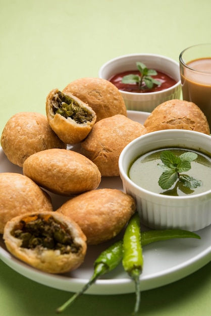 Indian special traditional matar or green peas Kachori served with tomato sauce and hot tea