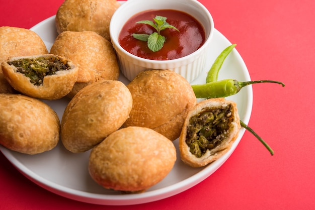 Indian special traditional matar or green peas Kachori served with tomato sauce and hot tea