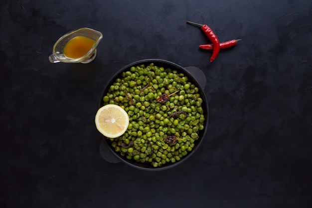 Indian Spiced Peas. Traditional Indian garnish of fried green peas with spices.