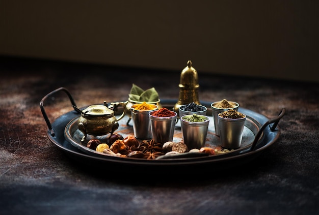 Indian Spices  spicy herbs and seasonings in a metal tray on the table