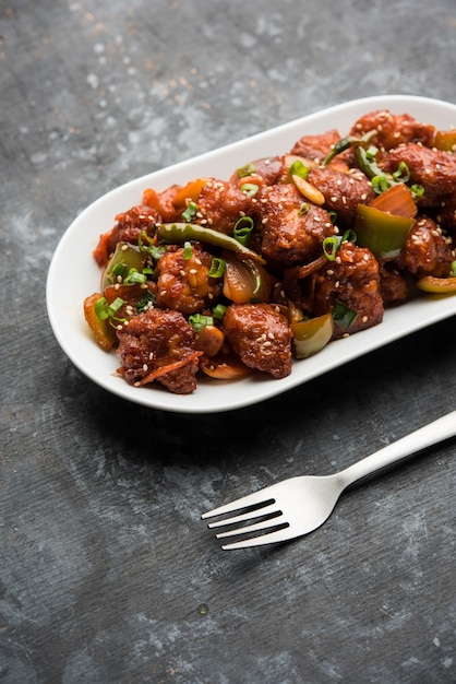 Indian Starter Chilli chicken, served in a plate. Selective focus