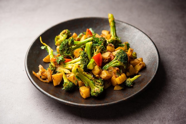 indian style broccoli and aloo poriyal or south indian broccoli and potato stir fry vegetable recipe