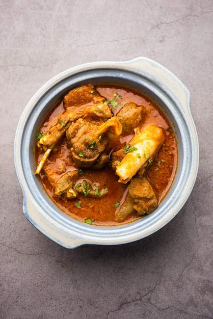 Indian style meat dish or Mutton OR Gosht Masala OR lamb rogan josh served in a bowl, selective focus