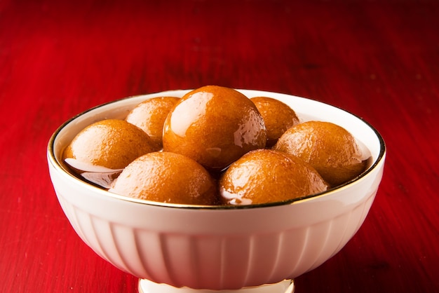 Indian sweet food Gulab Jamun, a popular wedding or festival dessert. selective focus