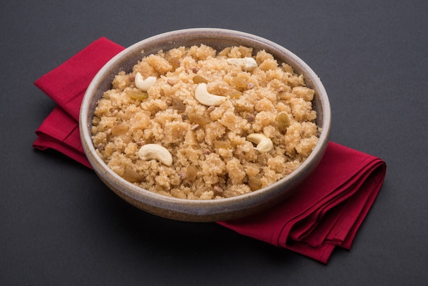 Indian sweet food halwa, sheera, shira lapsi, pudding, payasam or pongal served in a bowl