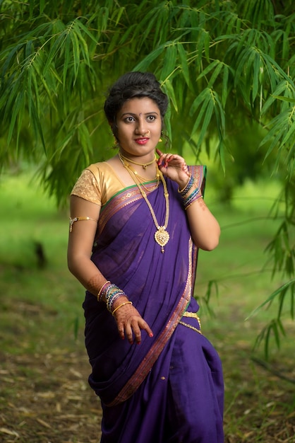 Indian Traditional Beautiful young girl in saree posing outdoors