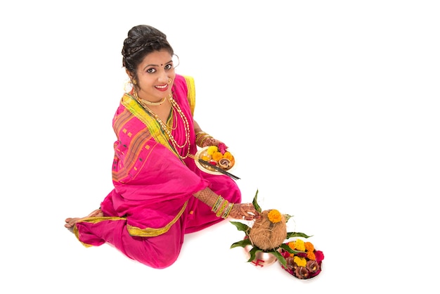 Indian Traditional Girl performing worship with copper kalash