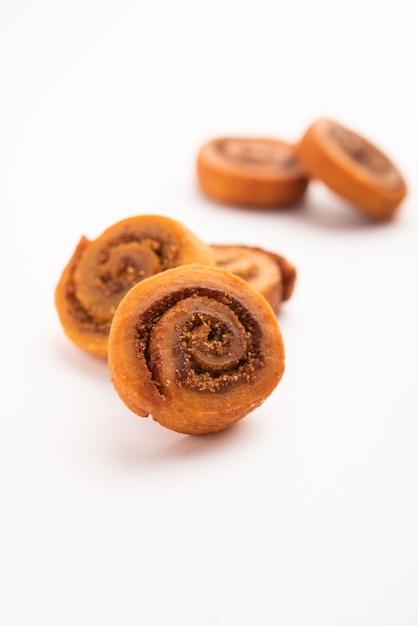 Indian Traditional tasty Snack Bhakarwadi Also Known as Bakarwadi, Bakarvadi, BhakarVadi or Bakar Wadi. Served in a plate or bowl. selective focus