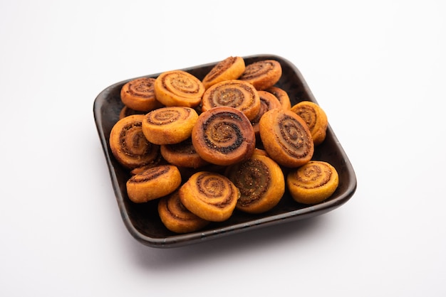 Indian Traditional tasty Snack Bhakarwadi Also Known as Bakarwadi, Bakarvadi, BhakarVadi or Bakar Wadi. Served in a plate or bowl