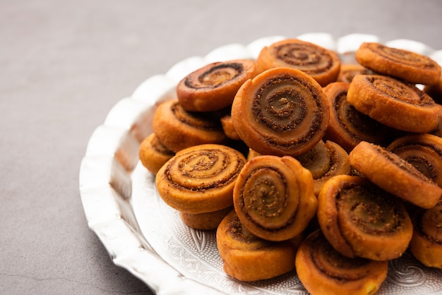 Indian Traditional tasty Snack Bhakarwadi Also Known as Bakarwadi, Bakarvadi, BhakarVadi or Bakar Wadi. Served in a plate or bowl