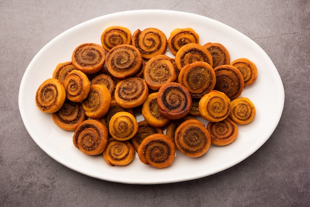 Indian Traditional tasty Snack Bhakarwadi Also Known as Bakarwadi, Bakarvadi, BhakarVadi or Bakar Wadi. Served in a plate or bowl