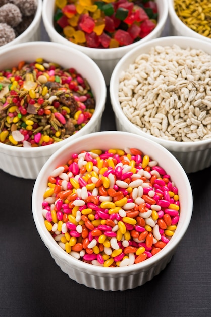 Indian variety of traditional mouth freshener in white ceramic bowls, selective focus