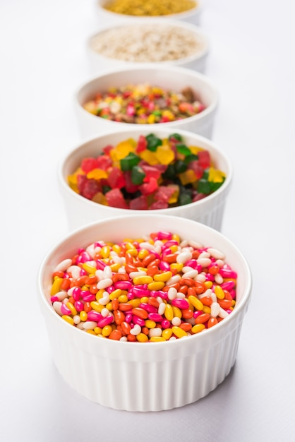 Indian variety of traditional mouth freshener in white ceramic bowls, selective focus