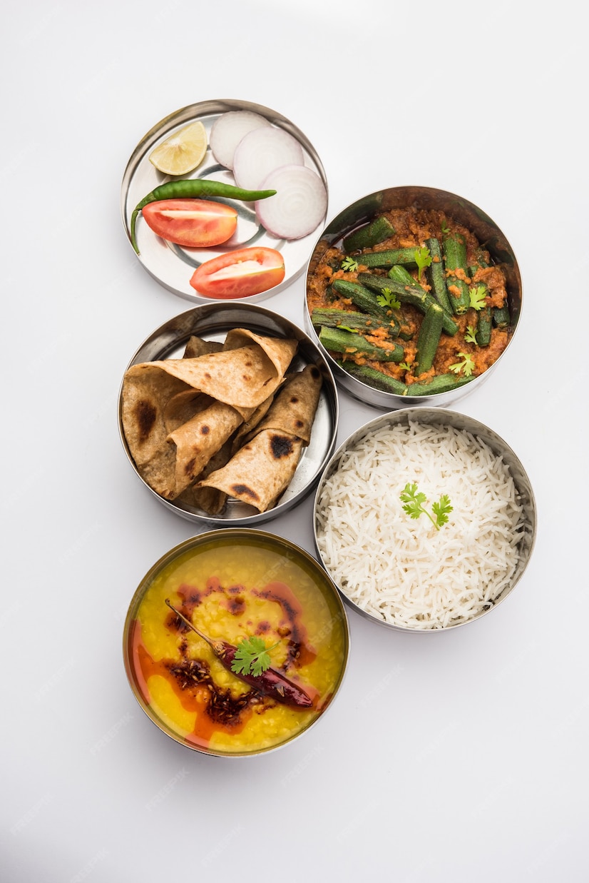 Premium Photo | Indian vegetarian Lunch Box or Tiffin made up of