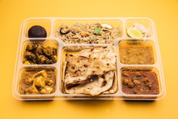 Indian vegetarian thali or food platter for parcel or for home delivery