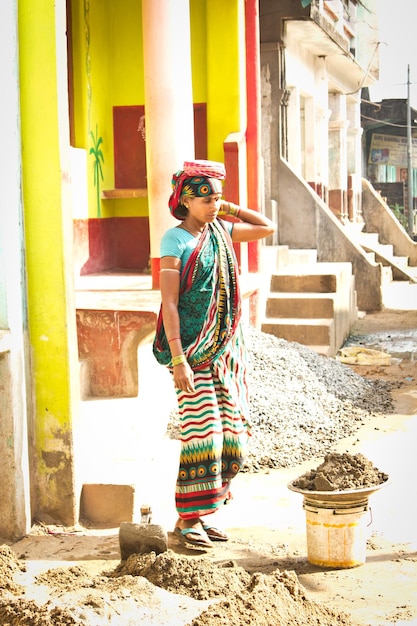 Indian woman busy in construction work