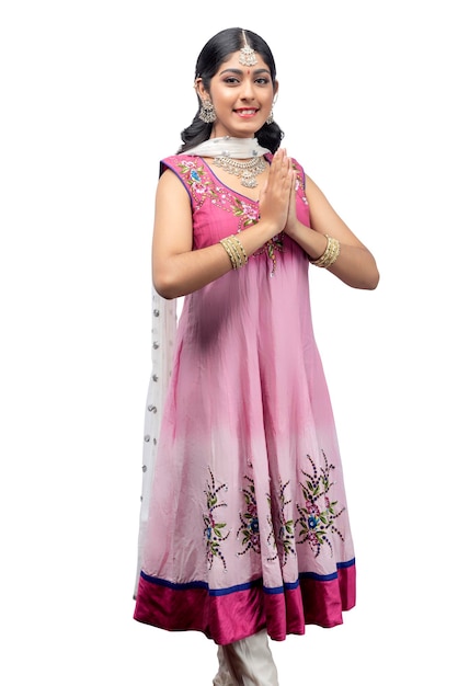 Indian woman in traditional Anarkali dress standing with greeting gesture