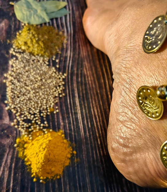 indian woman walks near the condiments in the bazaar