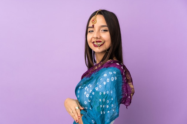 Indian woman with arms crossed and looking forward