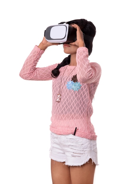 Indian young girl looking though VR device, 3D Virtual Reality Glasses headset, Girl with Modern imaging Future technology.