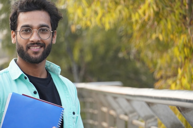  Indian Young   student with book closeup