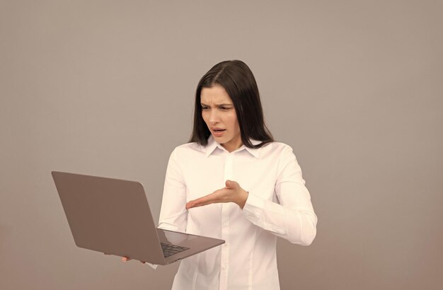 Indignant programmer use pc businesswoman with laptop network administrator hold computer office manager in white shirt concept of agile business woman working online modern wireless laptop