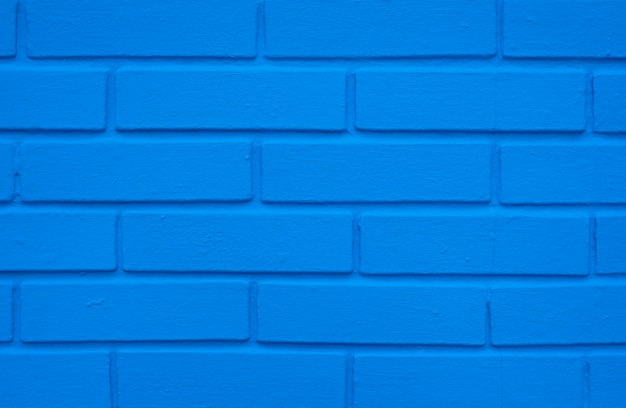 Indigo blauwe bakstenen muur, bouwtextuur