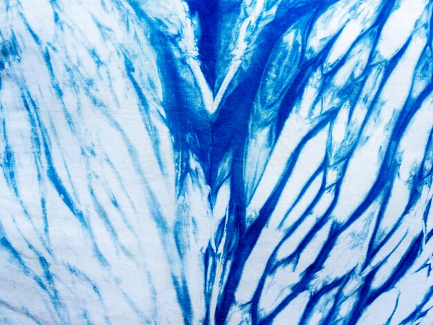 Indigo blauwe stof stropdas kleurstof patroon achtergrond. indigo-geverfde stoffentextuur met abstract etnisch grafisch motiefpatroon.