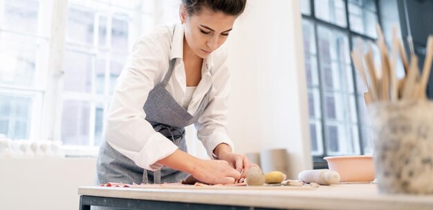 Individual products for the home Master in the ceramics studio Clay and porcelain dishes