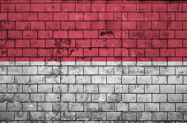 indonesia flag is painted onto an old brick wall