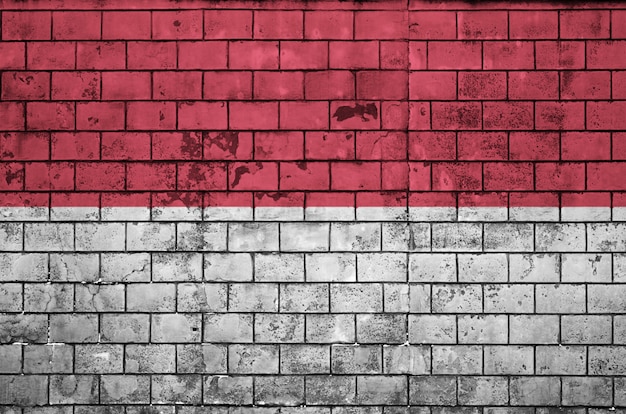 Indonesia flag is painted onto an old brick wall