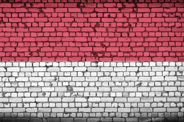 Indonesia flag is painted onto an old brick wall