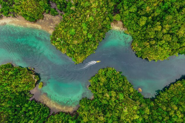 Indonesia is a beautiful place High angle shot of a little islets and islands in the middle of Indonesia