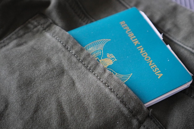 An Indonesian citizenship passport in a green denim pocket