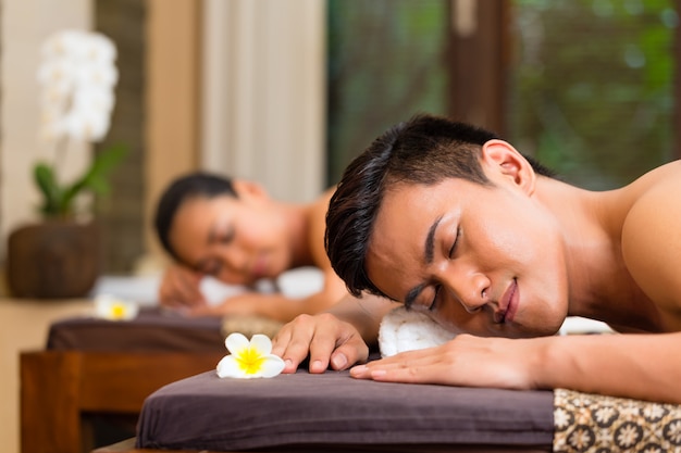 Indonesian couple having wellness massage