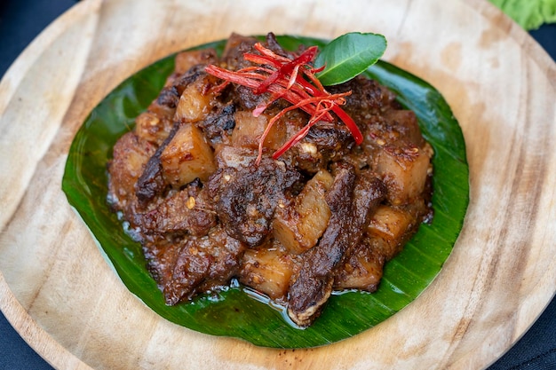 Indonesian dish fried meat in chili sauce closeup