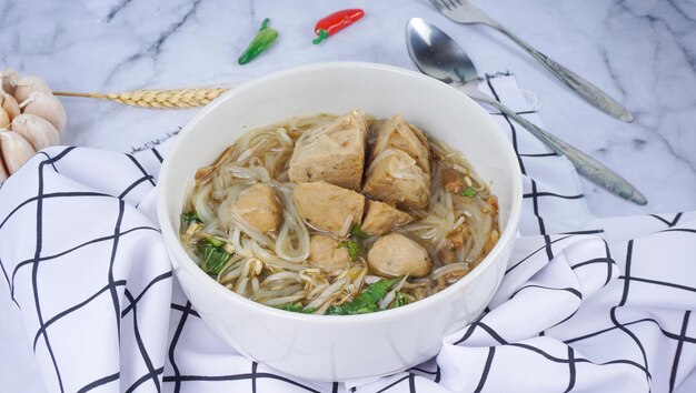 Indonesian Famous Foodstreet Bakso or Meatballs in white bowl